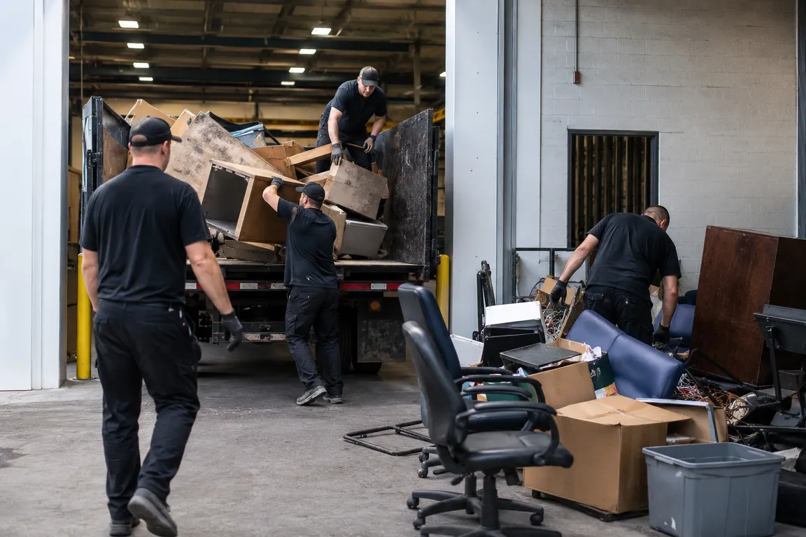 Commercial cleanup crew removing office furniture in Moose Jaw