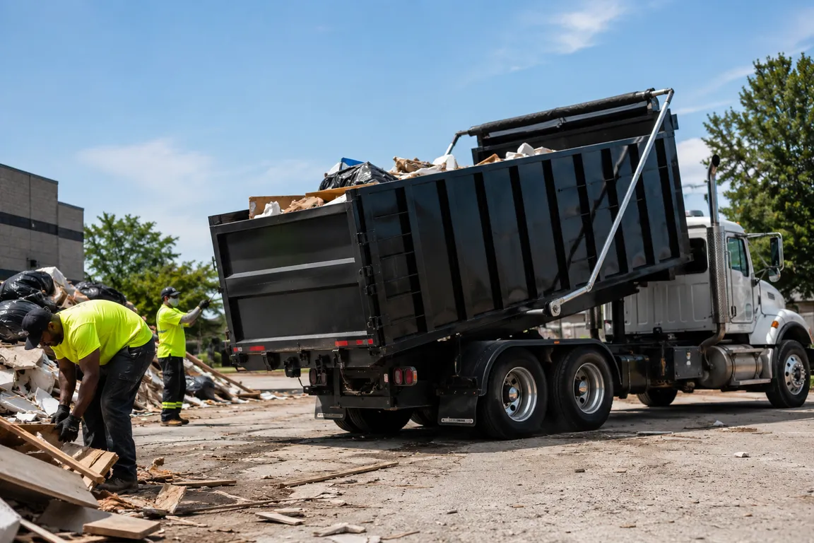 Crew hauling large volumes of debris from a cleanup project