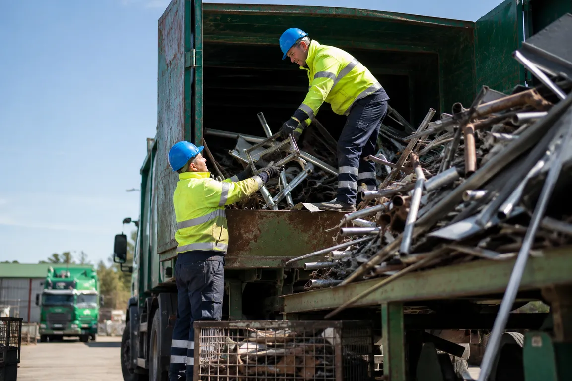 Crew collecting scrap metal for recycling and recovery